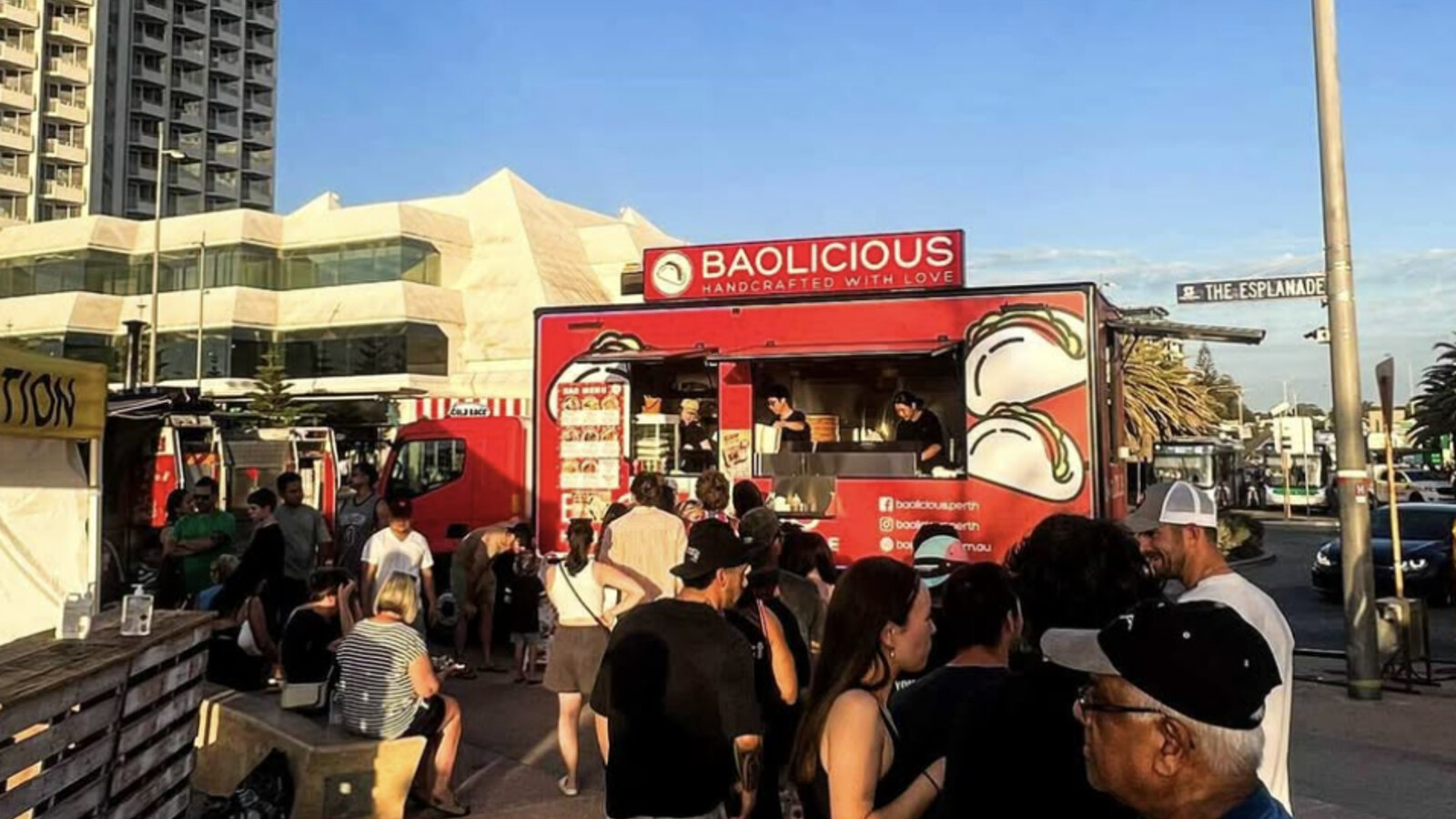 Baolicious red food truck with illustrated bao bun graphics and "Handcrafted with Love" signage