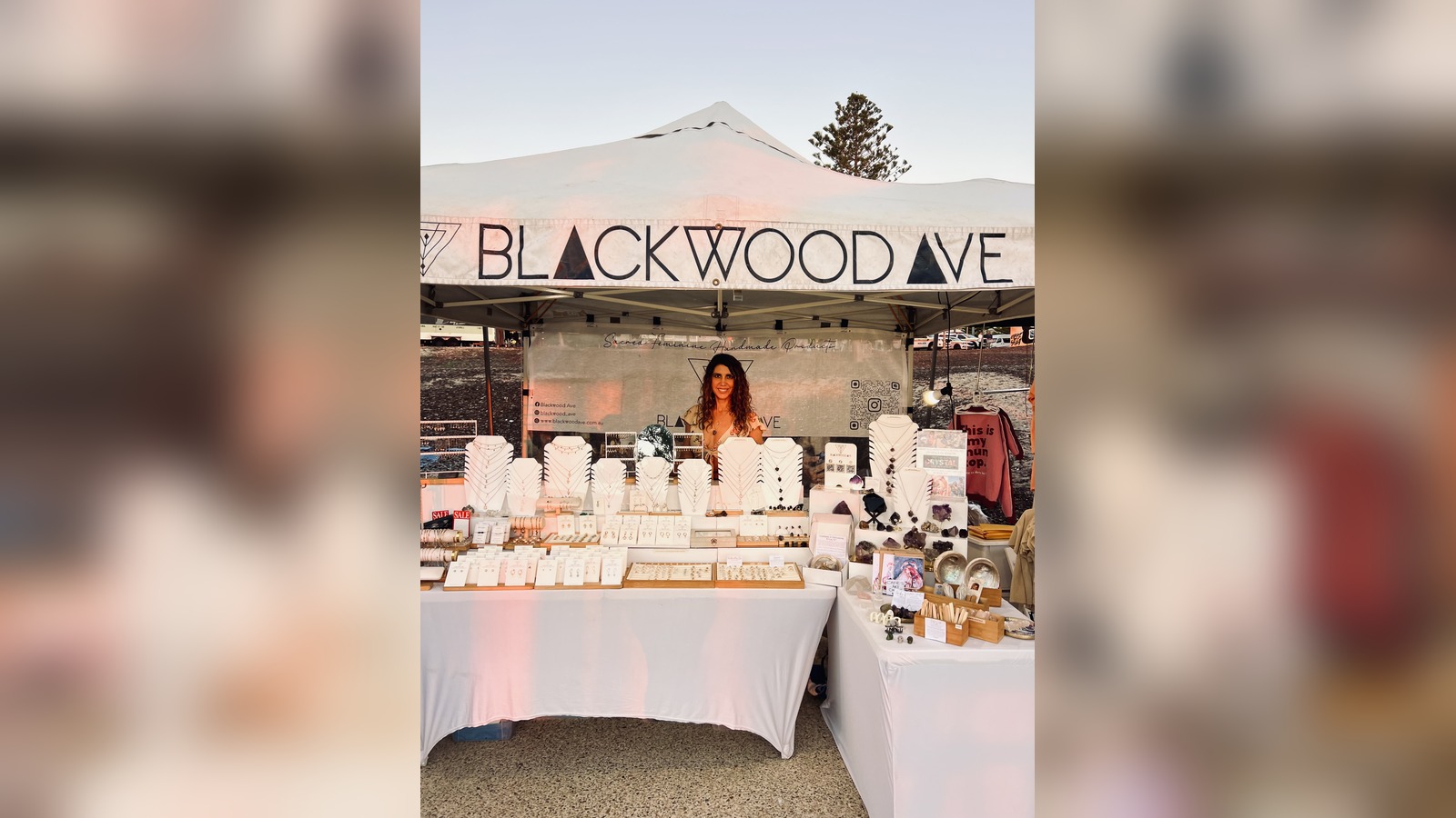 Blackwood Ave jewellery stall with a woman standing behind tables of necklaces