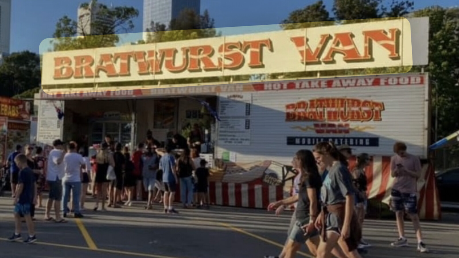 Bratwurst Van food trailer with red-and-white striped counter and "Hot Take Away Food" signage