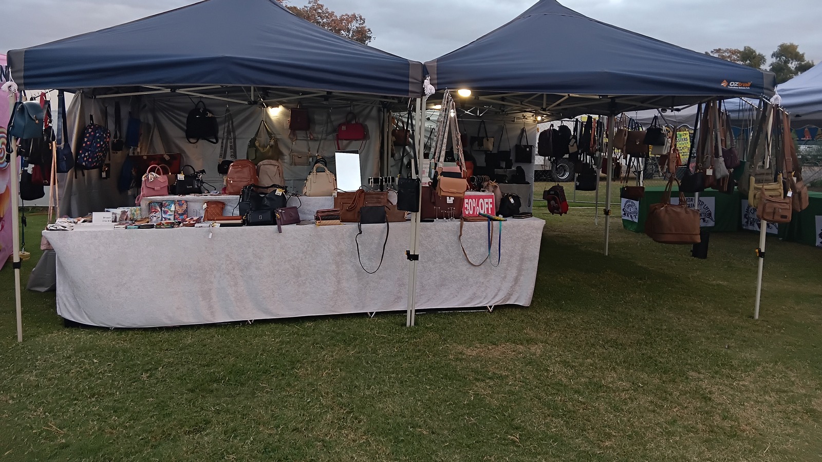 Twin marquees hung with handbags