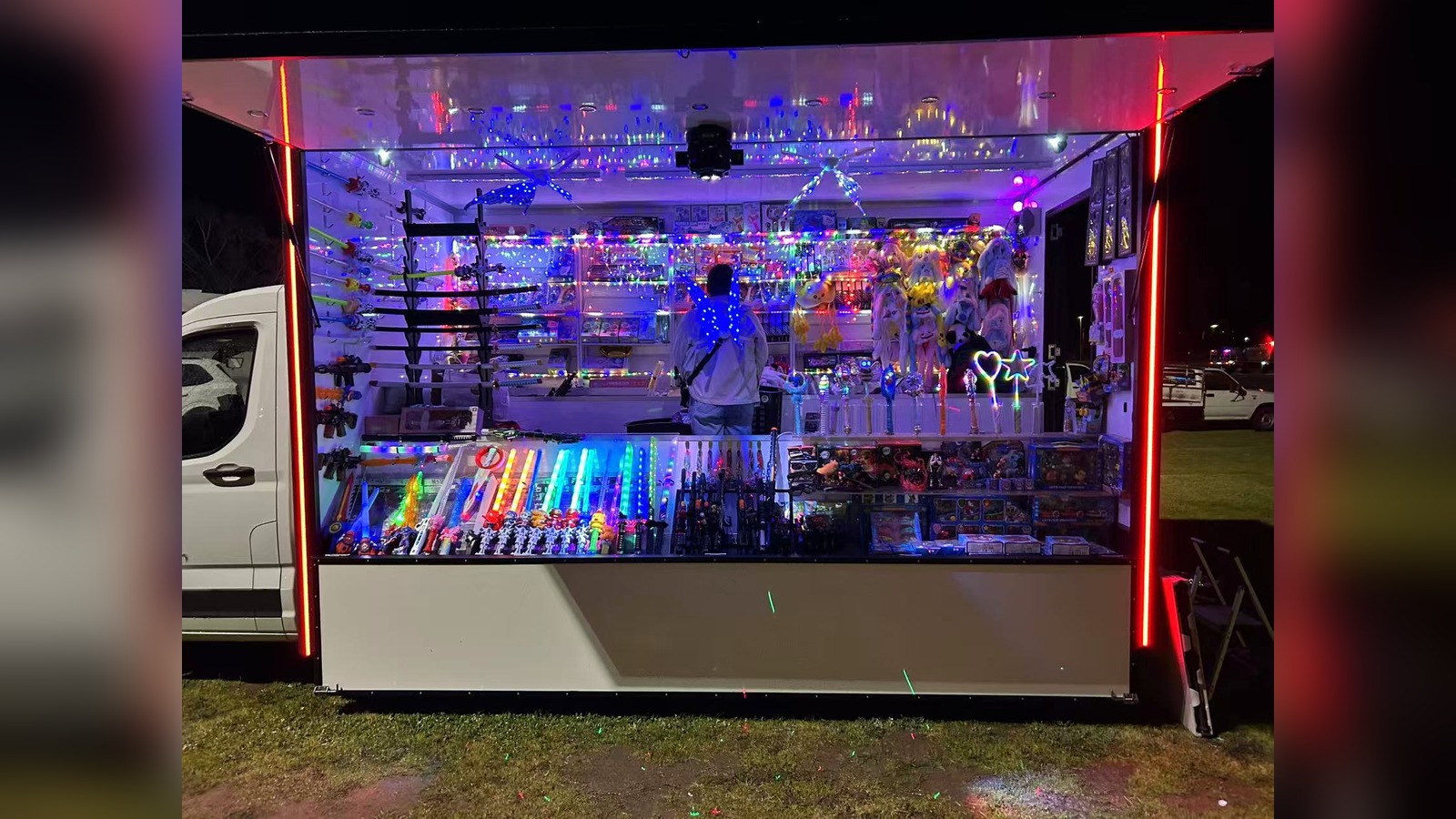 Toy truck stall lit with colourful LED lights